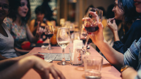 Canva - People Drinking Liquor and Talking on Dining Table Close-up Photo
